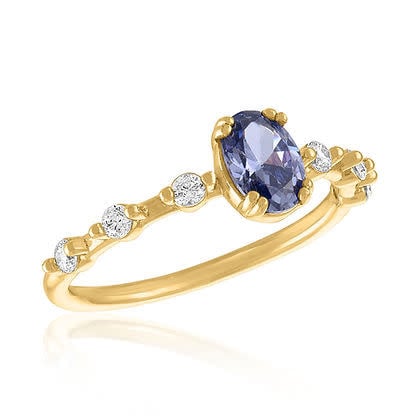 Gold layered ring featuring an oval lavender stone with a statement silhouette.