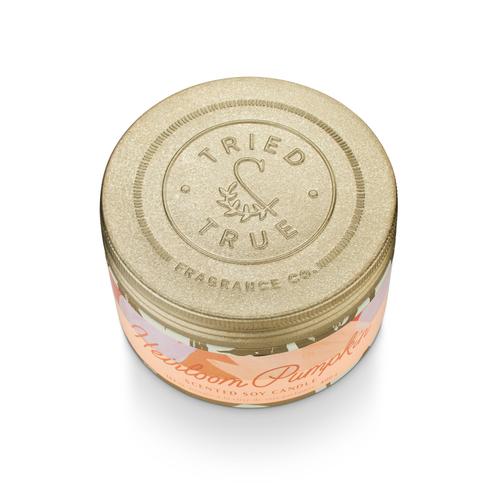Large tin canister with a pumpkin motif featuring the text Tried & True Heirloom Pumpkin.