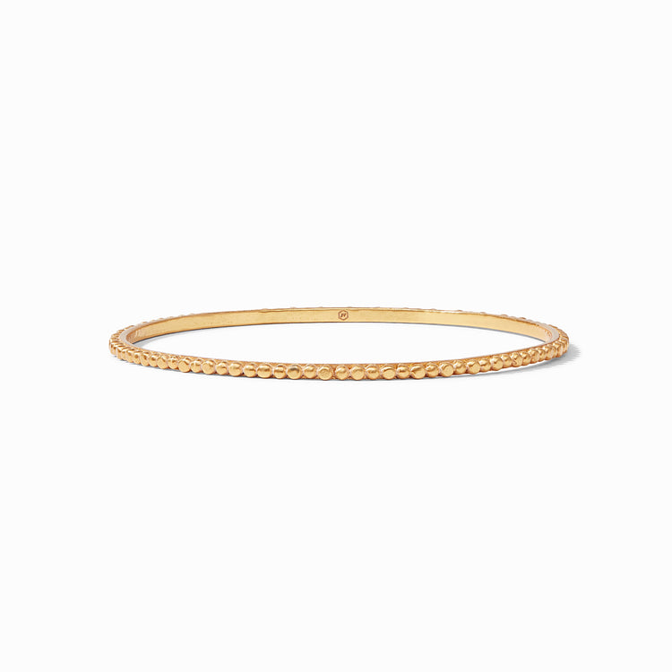 Colette Bead Bangle, a thin gold-toned circular bracelet with a textured beaded outer edge.