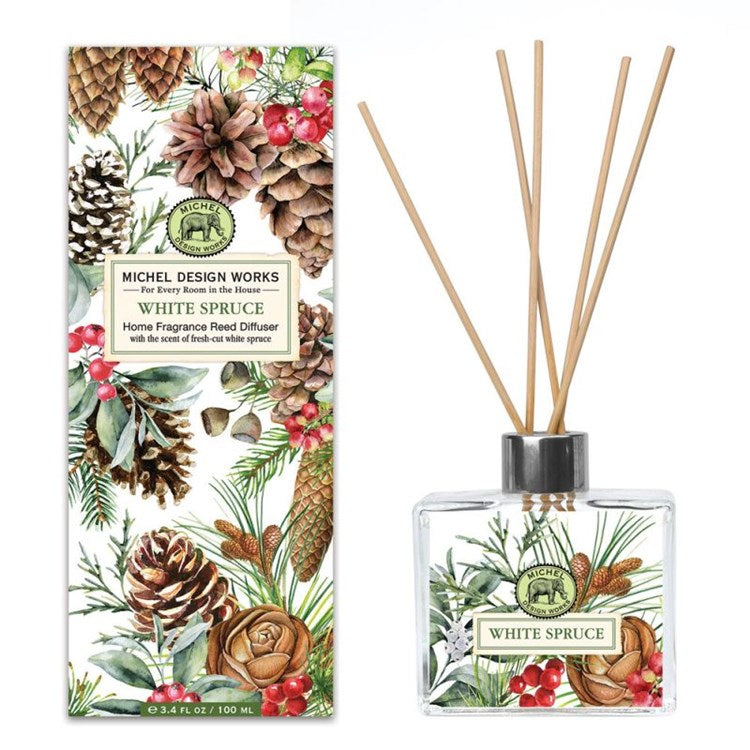 Michel Design Works White Spruce reed diffuser with botanical pinecone print and four reeds.