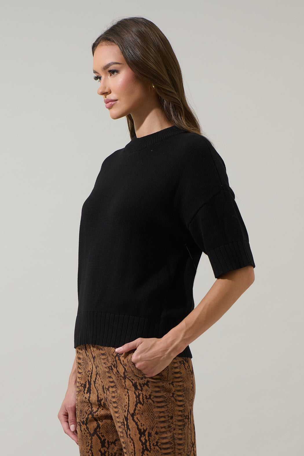 Relaxed fit drop shoulder cotton sweater top in light blue with ribbed cuffs.