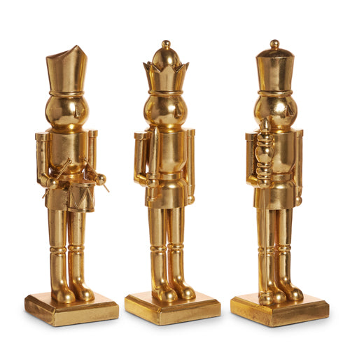 Three 18-inch gold resin nutcrackers: a drummer, a swordsman, and one holding a staff.