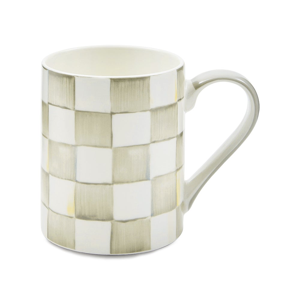 Handmade check porcelain mug with black grid pattern on white background.