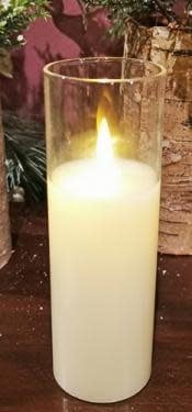 Cream-colored LED pillar candle inside a clear glass cylinder holder.
