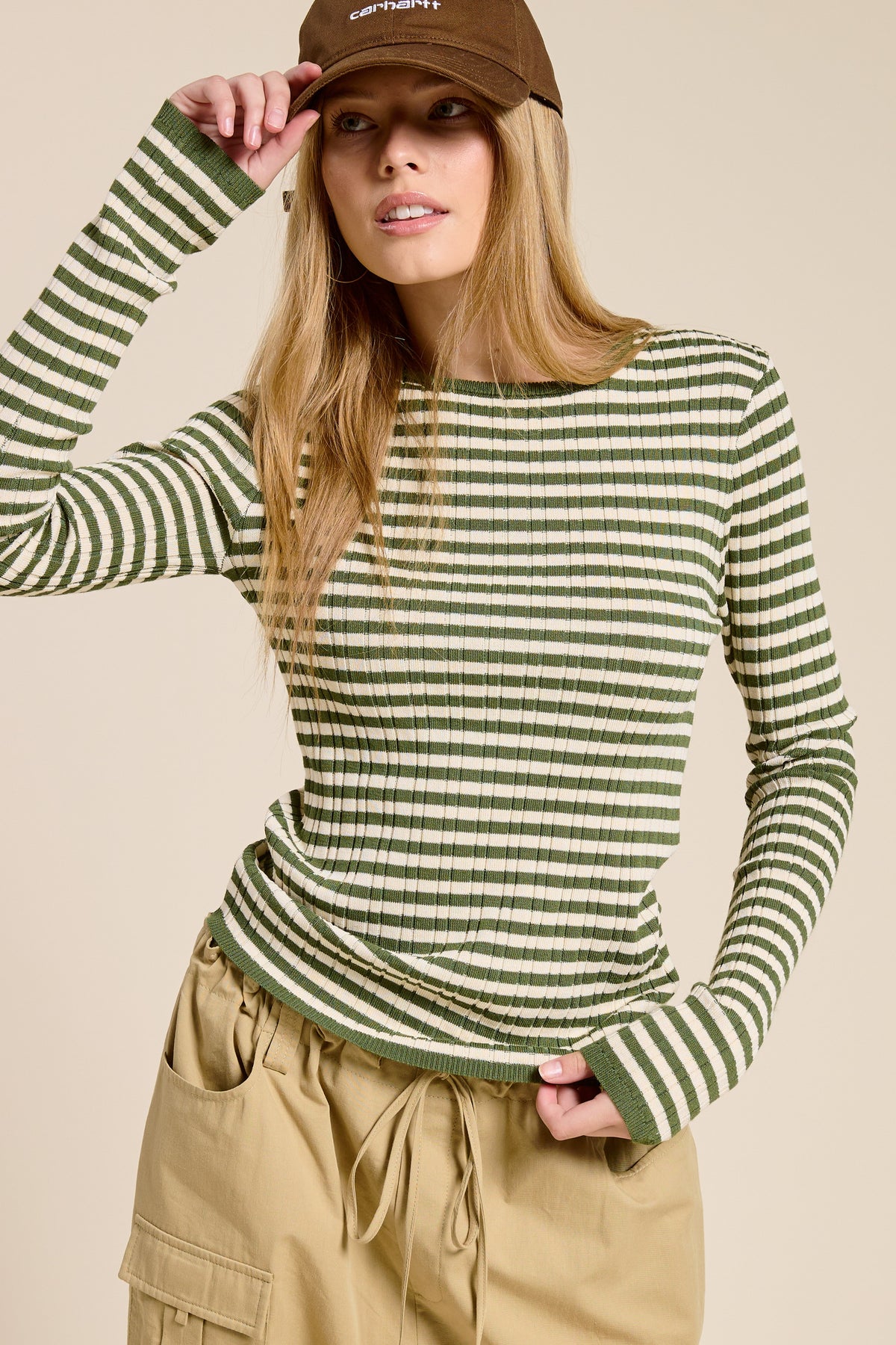 Ariah ribbed knit long-sleeve top with horizontal stripes in warm neutral tones and a classic crew neckline.