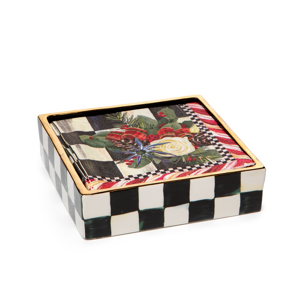 Ceramic cocktail napkin holder with a courtly check pattern in blue and white.