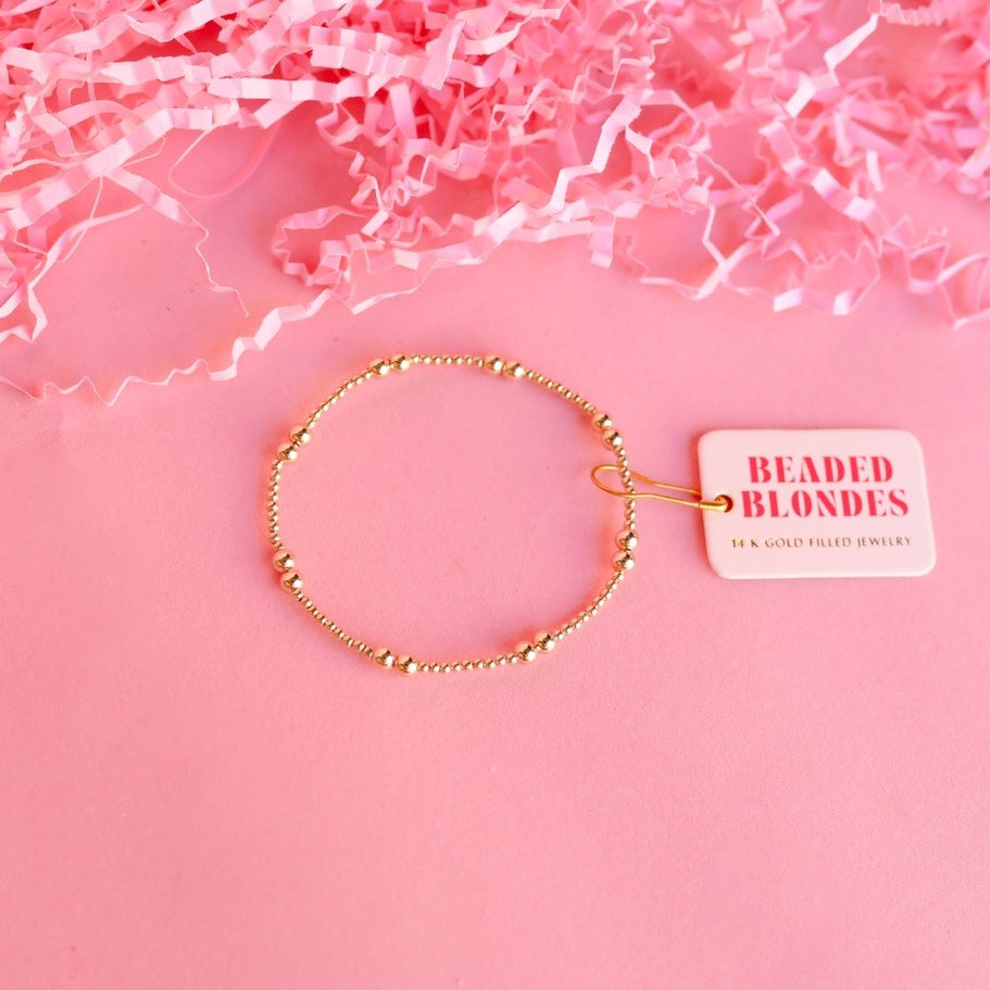 6.75-inch Leah bracelet in gold featuring a delicate chain link pattern on an elastic string.