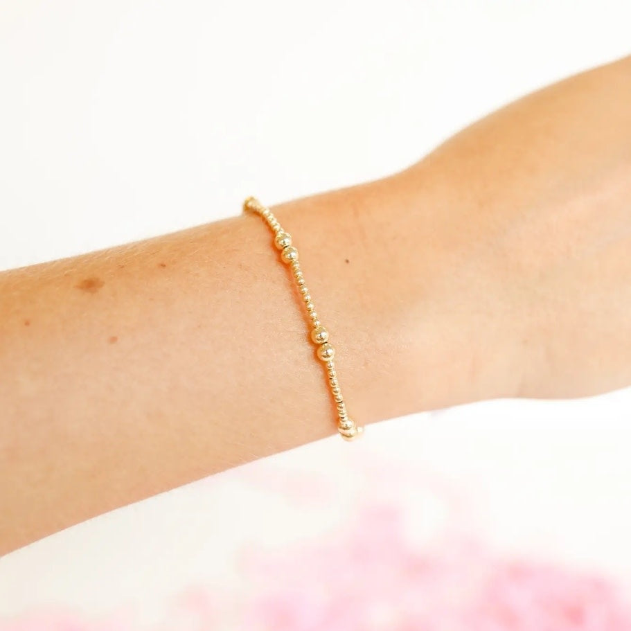 6.75-inch Leah bracelet in gold with a delicate chain link pattern on an elastic string.