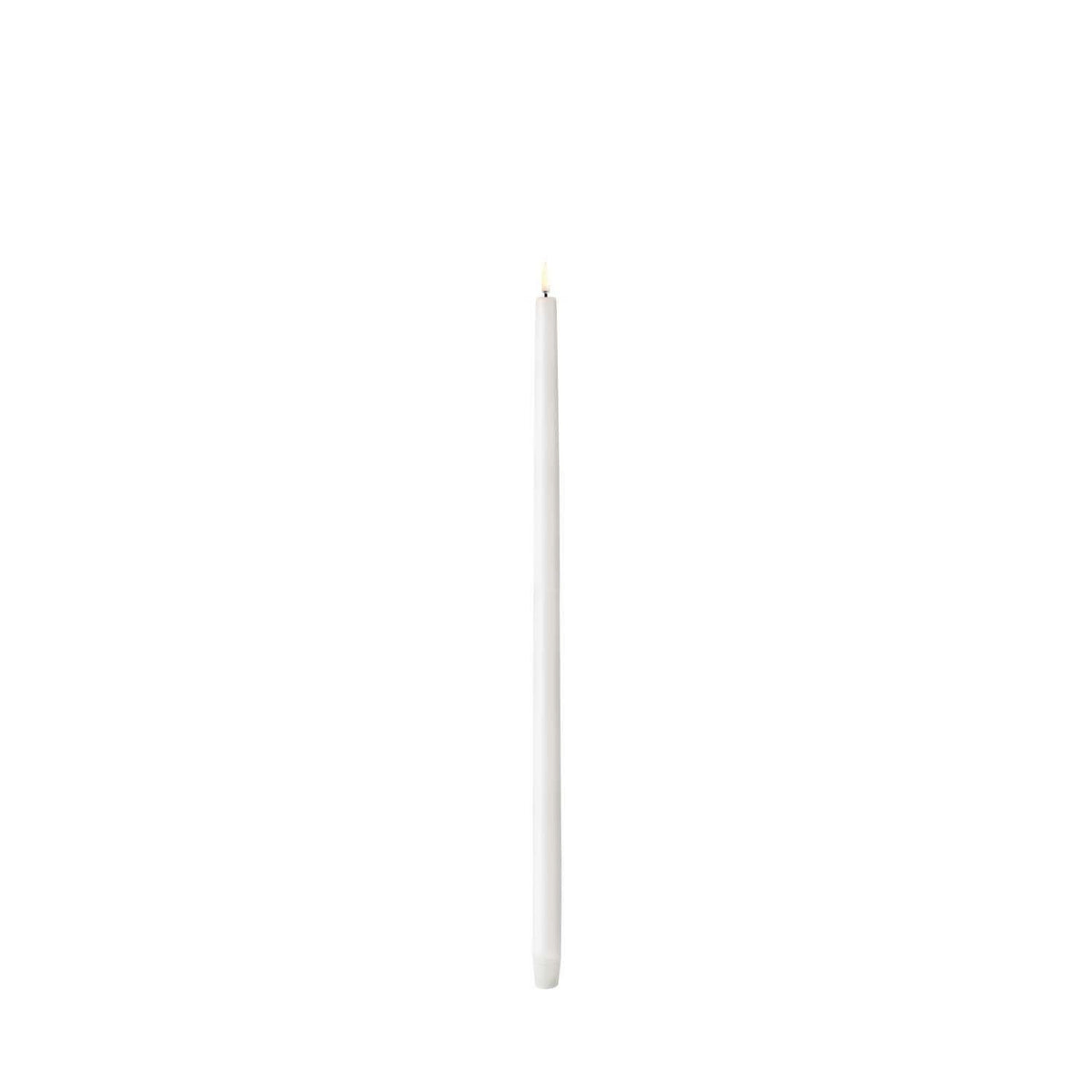 Tall white LED taper candle with smooth Nordic finish standing upright