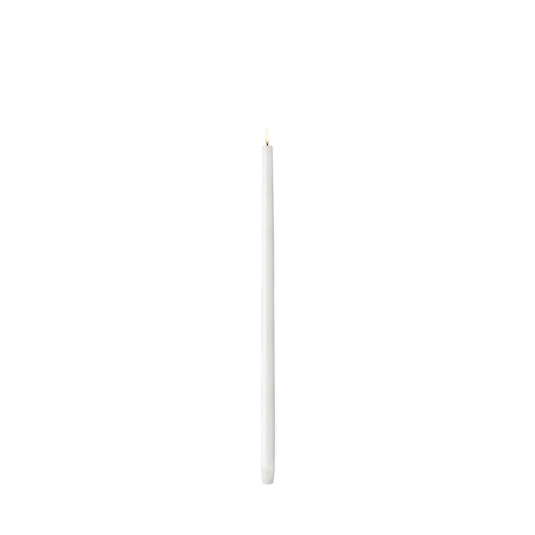 Tall white LED taper candle with smooth Nordic finish standing upright