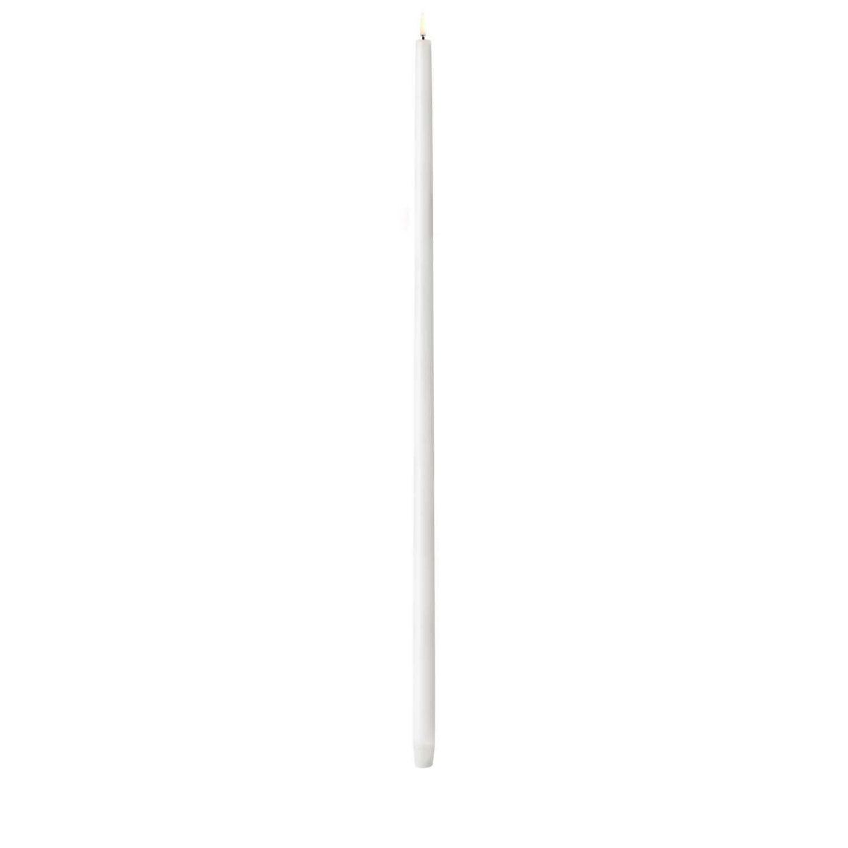 Tall Nordic white LED taper candle with smooth finish standing upright
