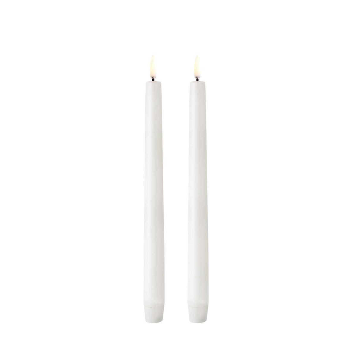 Tall white LED taper candle with smooth finish on a dark background