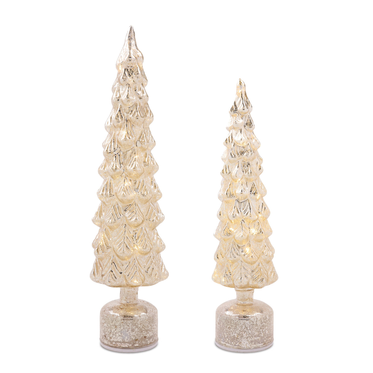 Small battery-operated LED tree with soft white twinkling lights on a tabletop.