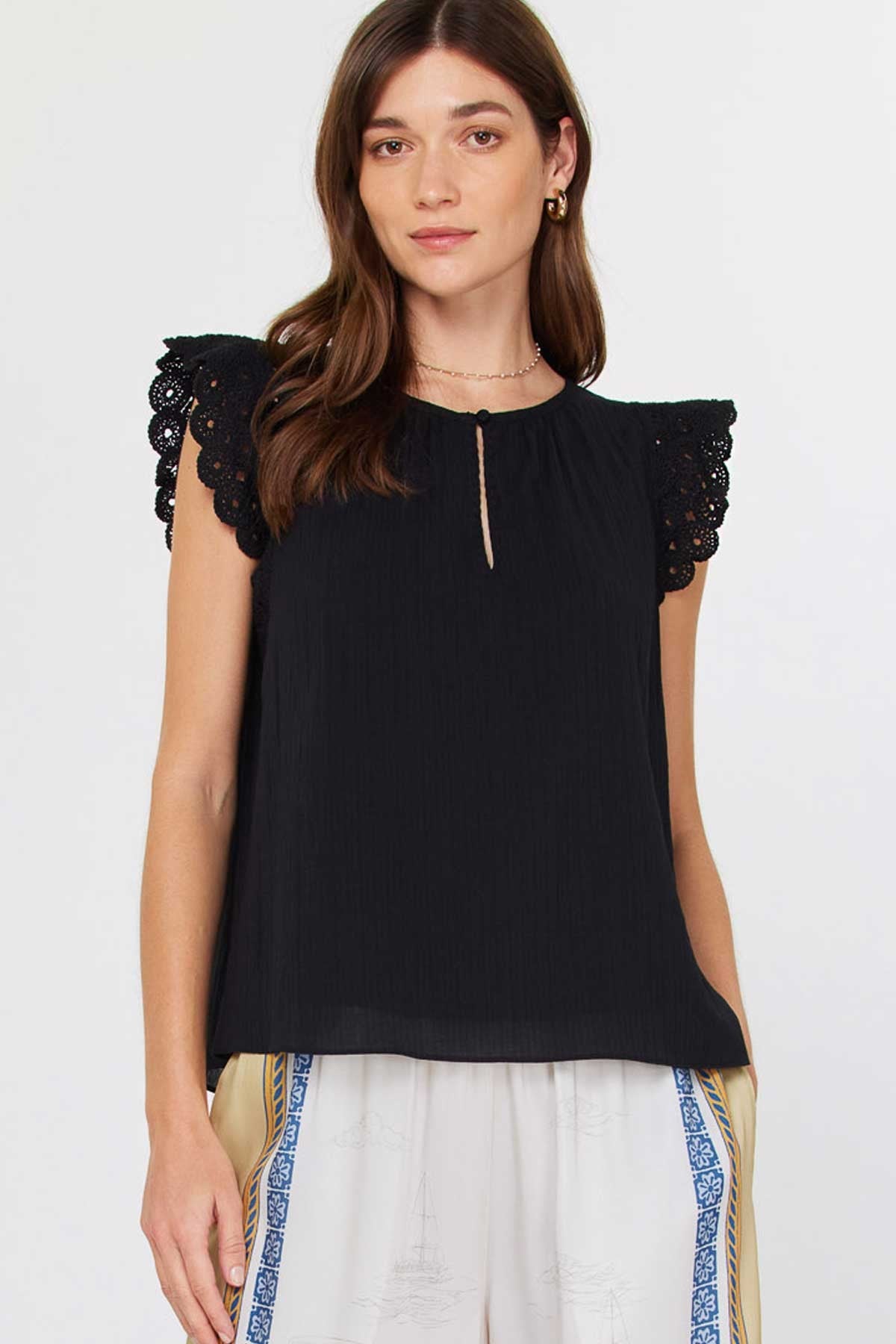 Annie Crochet sleeve blouse in light blue with round neck, short sleeves, front buttons, and keyhole detail.