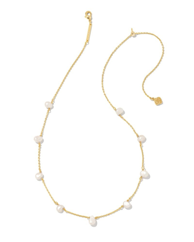 Leighton gold chain necklace featuring nine white cultured freshwater pearls with a lobster clasp.