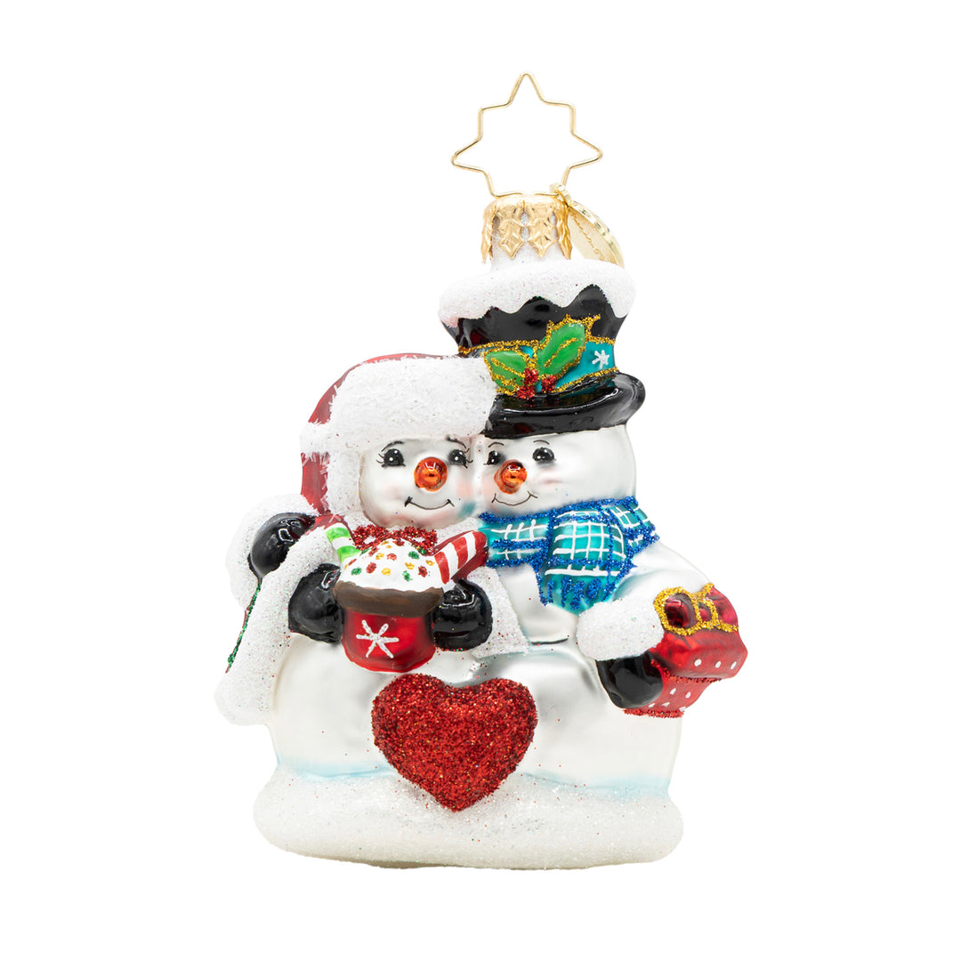 Winter Lovebirds Gem glass ornament featuring two snowmen cuddling with a red glitter heart.
