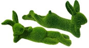 Green Laying Bunny plush toy with soft fabric texture.