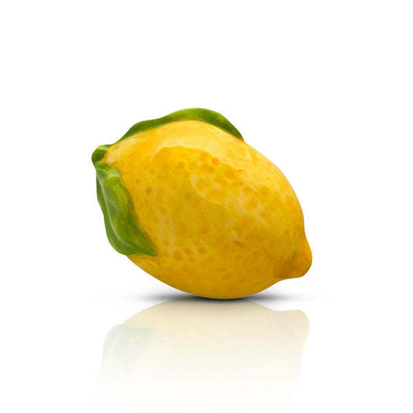 Mini lemon-shaped squeeze bottle with a yellow body and white cap.
