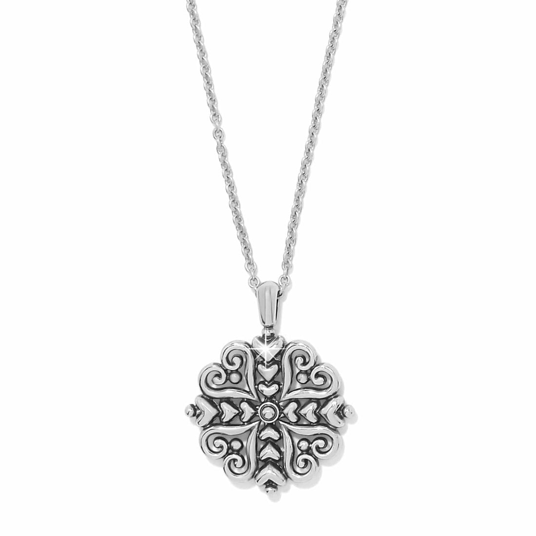 Alcazar Heart Two Tone Necklace featuring a silver and gold filigree heart pendant on a chain.