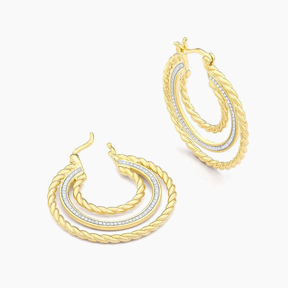 Thin silver hoop earrings with a small genuine diamond accent on each side.