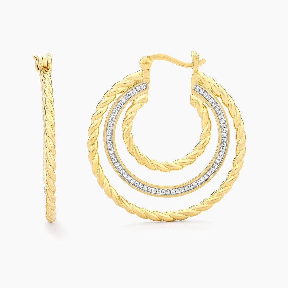 Thin gold hoop earrings with a single small diamond accent on the front.