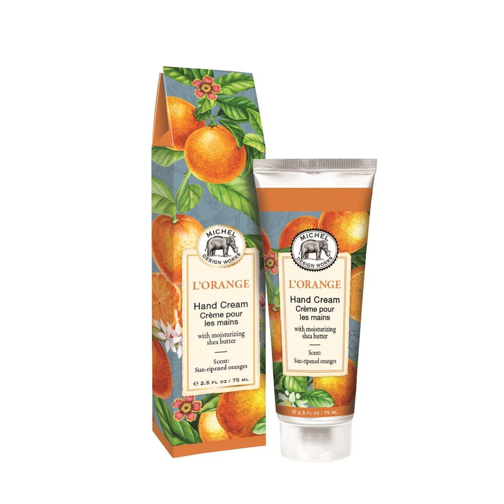 Michel Design Works L'Orange hand cream tube and box with orange fruit and floral pattern.