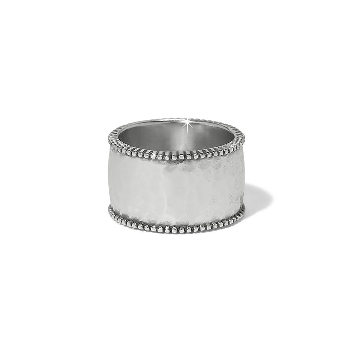 Wide silver plated ring with a hammered texture and beaded edges.