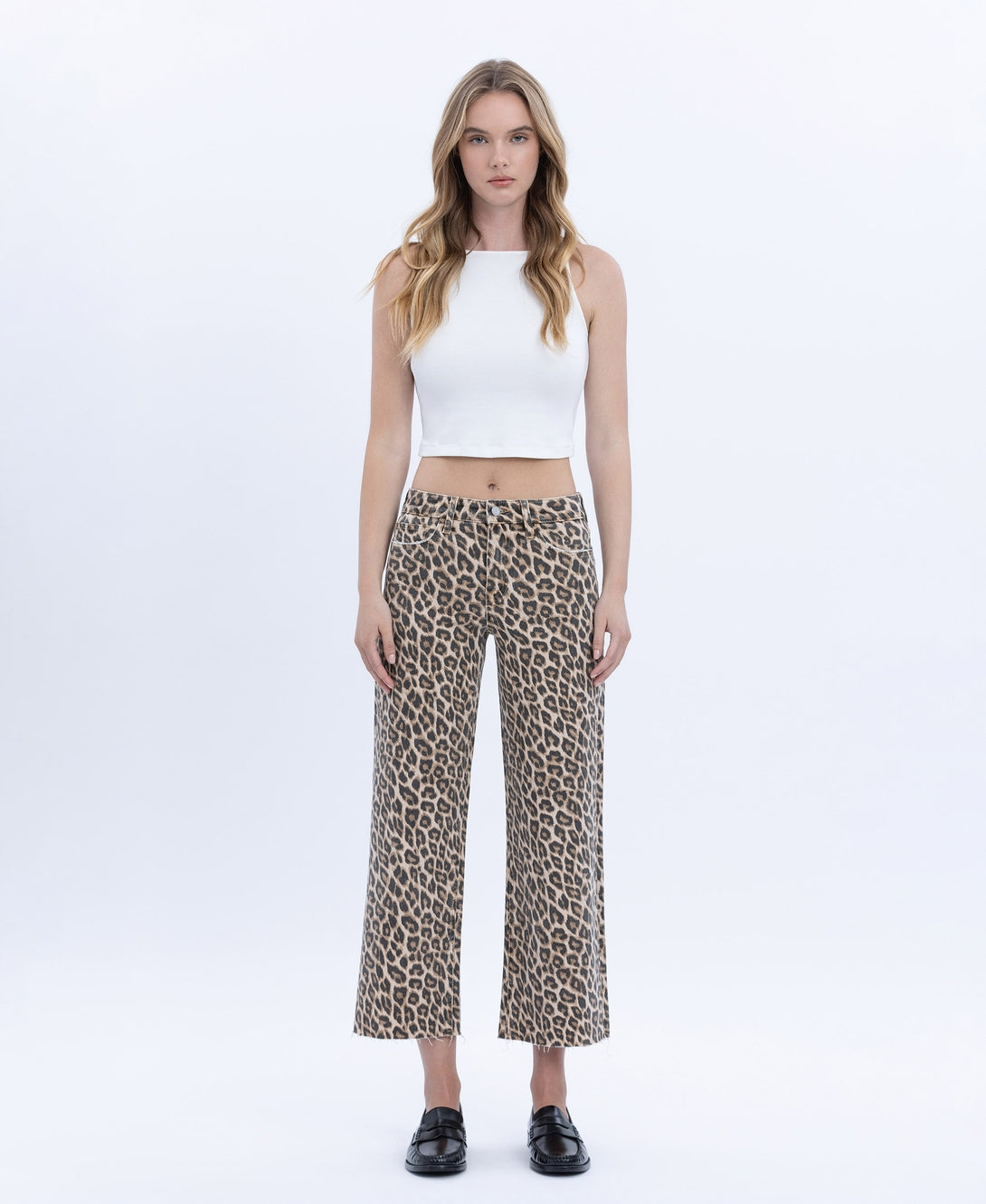 Women's high-rise animal print wide-leg crop jeans in stretch denim with a raw hem.