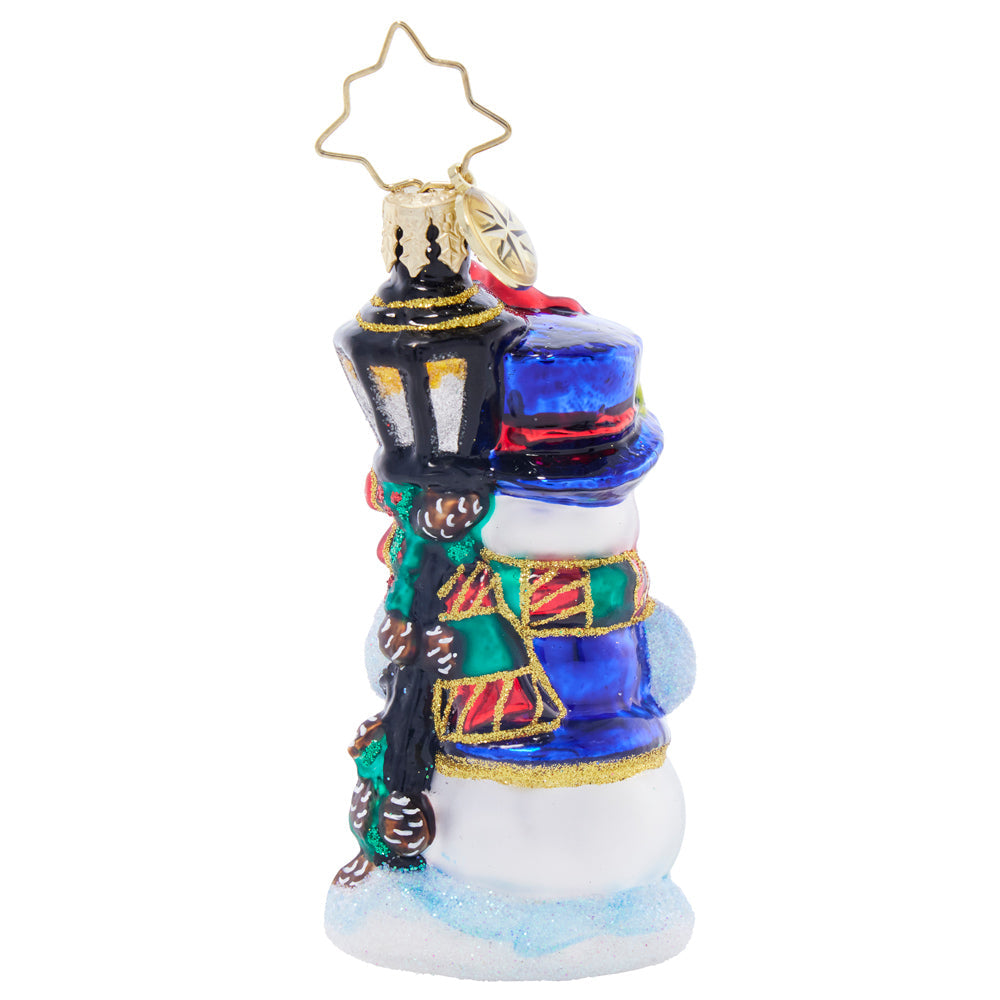 Feathered Friends Snowman Gem glass ornament featuring a snowman with a blue hat and lamp post.