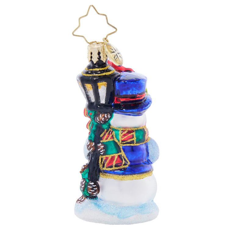 Feathered Friends Snowman Gem glass ornament featuring a snowman with a blue hat and lamp post.