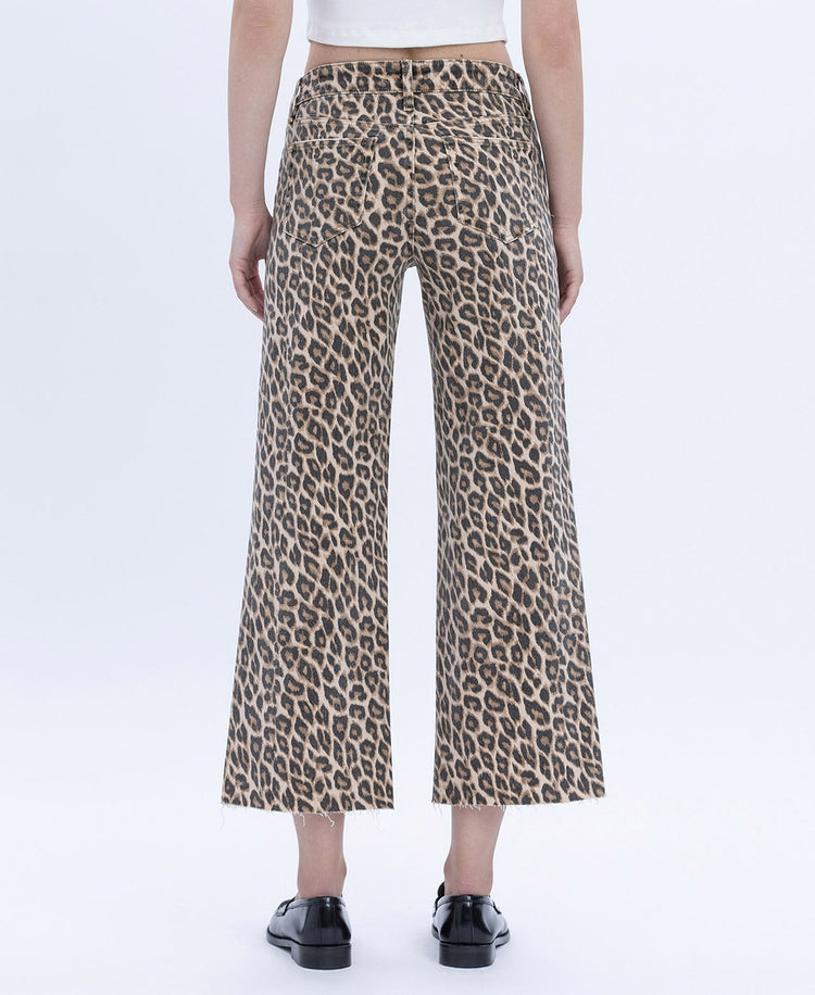 Women's high-rise wide-leg jeans in animal print with raw hem.
