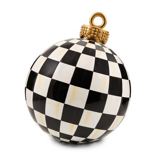 Black and white checkered tabletop ornament with a gold decorative cap and ring.