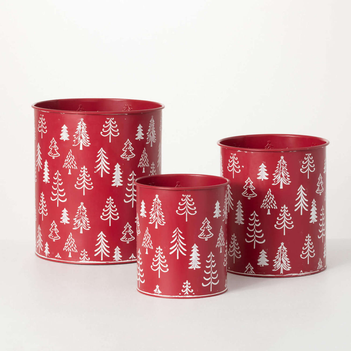 Red planter with Christmas tree print motif