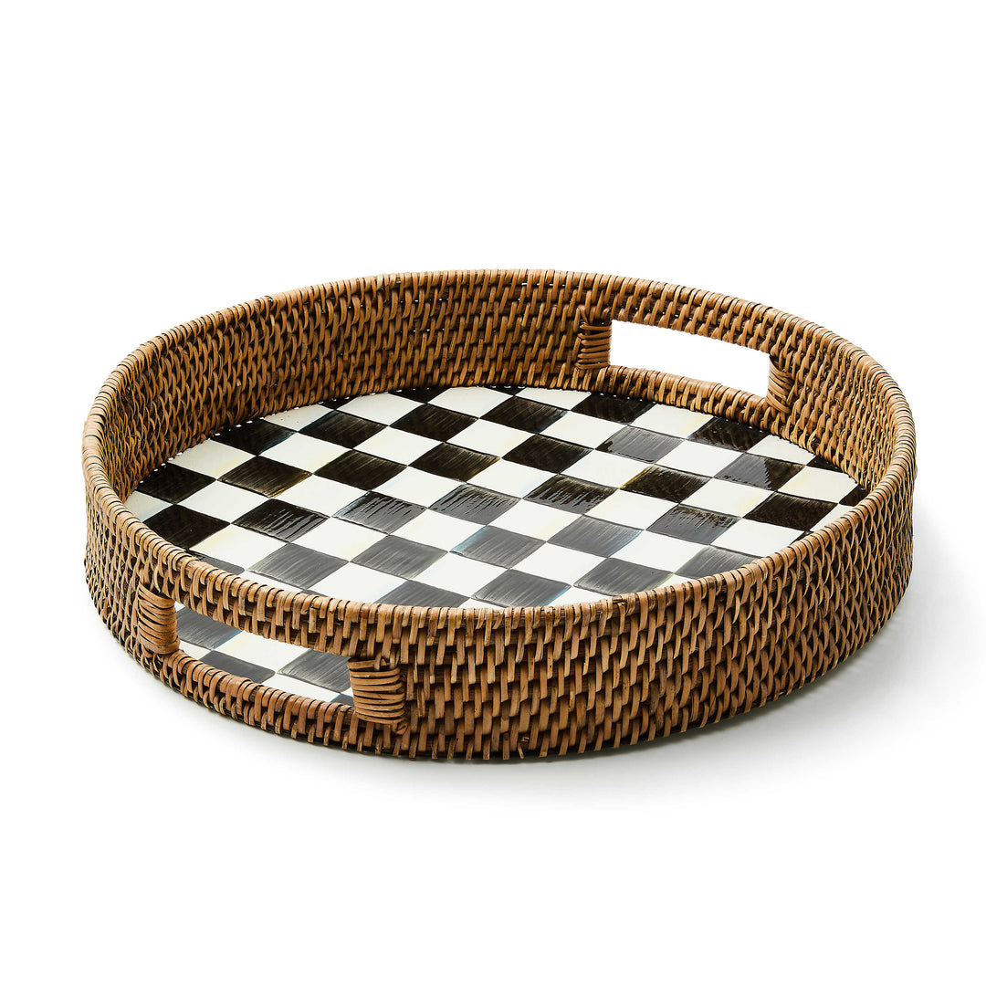 Round serving tray with hand-painted black and white checkered enamel base and woven rattan sides.