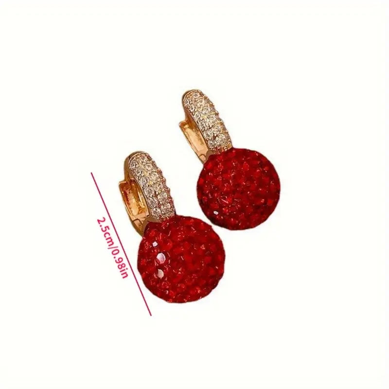 Red ball-shaped sparkle earrings with a glossy finish