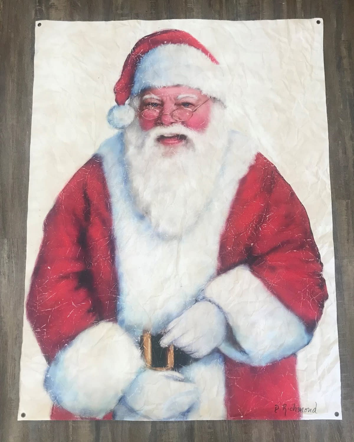 Paper art wall hanging featuring a red Santa Claus silhouette with white beard against a festive background.