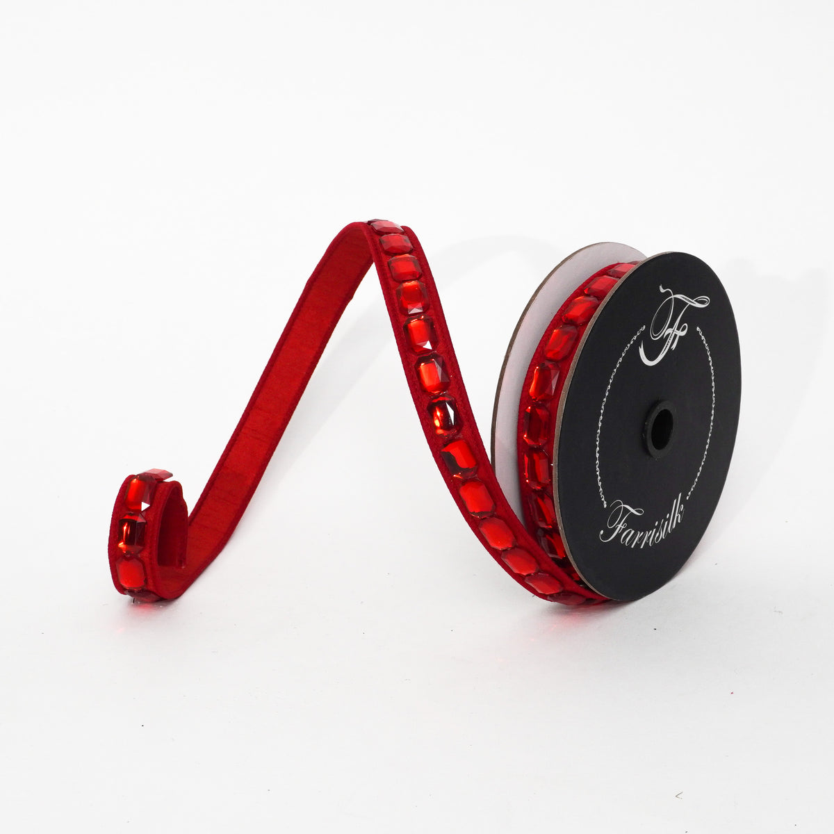 1 inch by 5 yard red ribbon with emerald-cut red gems on a black spool.