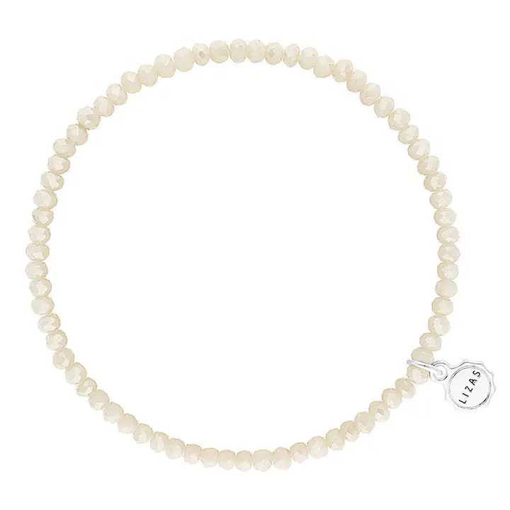 Lizas Quadro Big Bright Colours stretch bracelet with cream crystal beads and a silver logo charm.