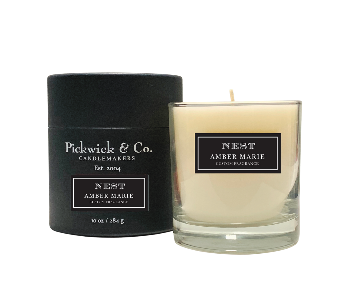 Pickwick Candle in a clear glass jar with a white wick.