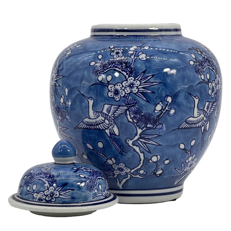 10-inch blue and white ceramic ginger jar with floral and crane chinoiserie design and lid.
