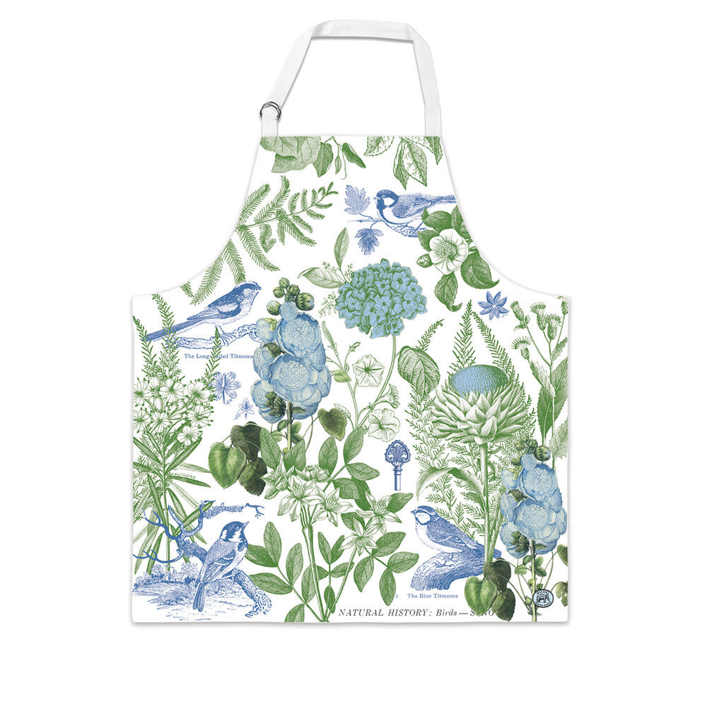 White cotton chef apron with a blue and green botanical print featuring birds and flowers.