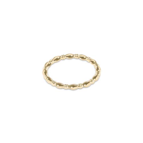 A beaded harmony ring in gold-filled metal with a classic circular silhouette.