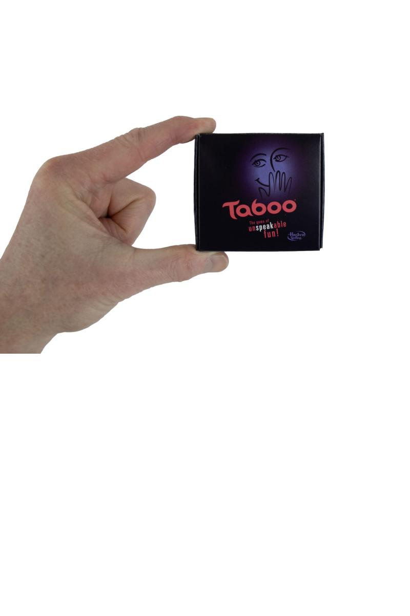A hand holding the miniature World's Smallest Taboo game box to show its tiny size.