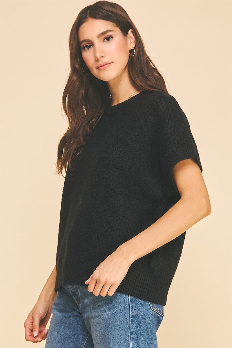Bailey solid cap sleeve knit sweater in a neutral tone with a relaxed silhouette.