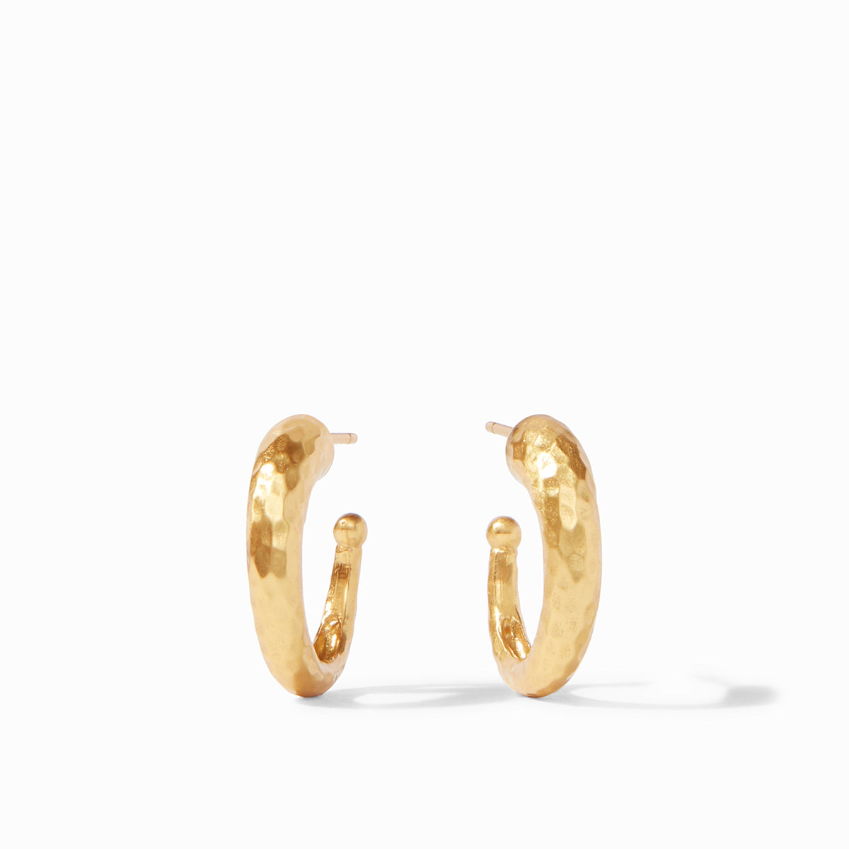 A pair of 24K gold plated hammered hoop earrings on a white background.