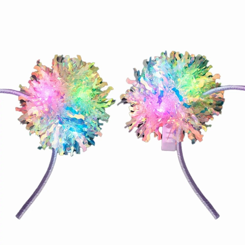 Lavender headband with pink, green, blue, yellow crinkle tinsel and fluffy pom-pom ears.