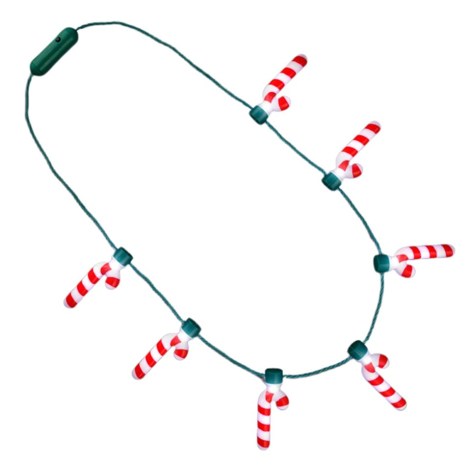 Green string necklace with seven white candy cane charms featuring internal bright white LED lights.