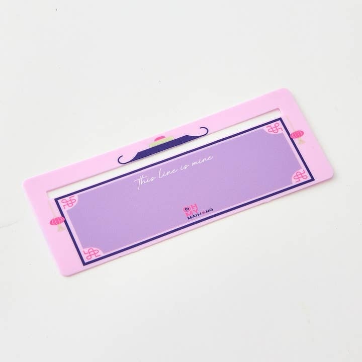 Lilac Mahjong Line Finder tool with a smooth curved handle designed to help locate lines on cards.