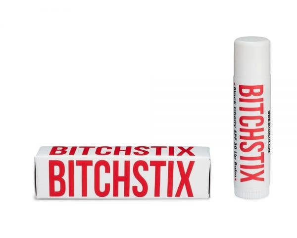 Black Cherry lip balm tube with a silver cap against a white background.