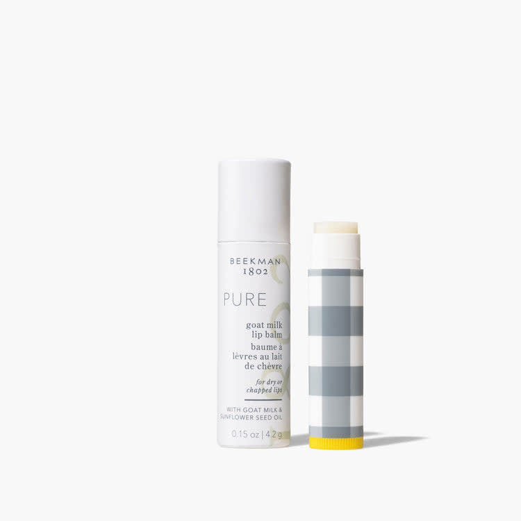 Beekman Pure lip balm in a clear tube with gingham pattern packaging.